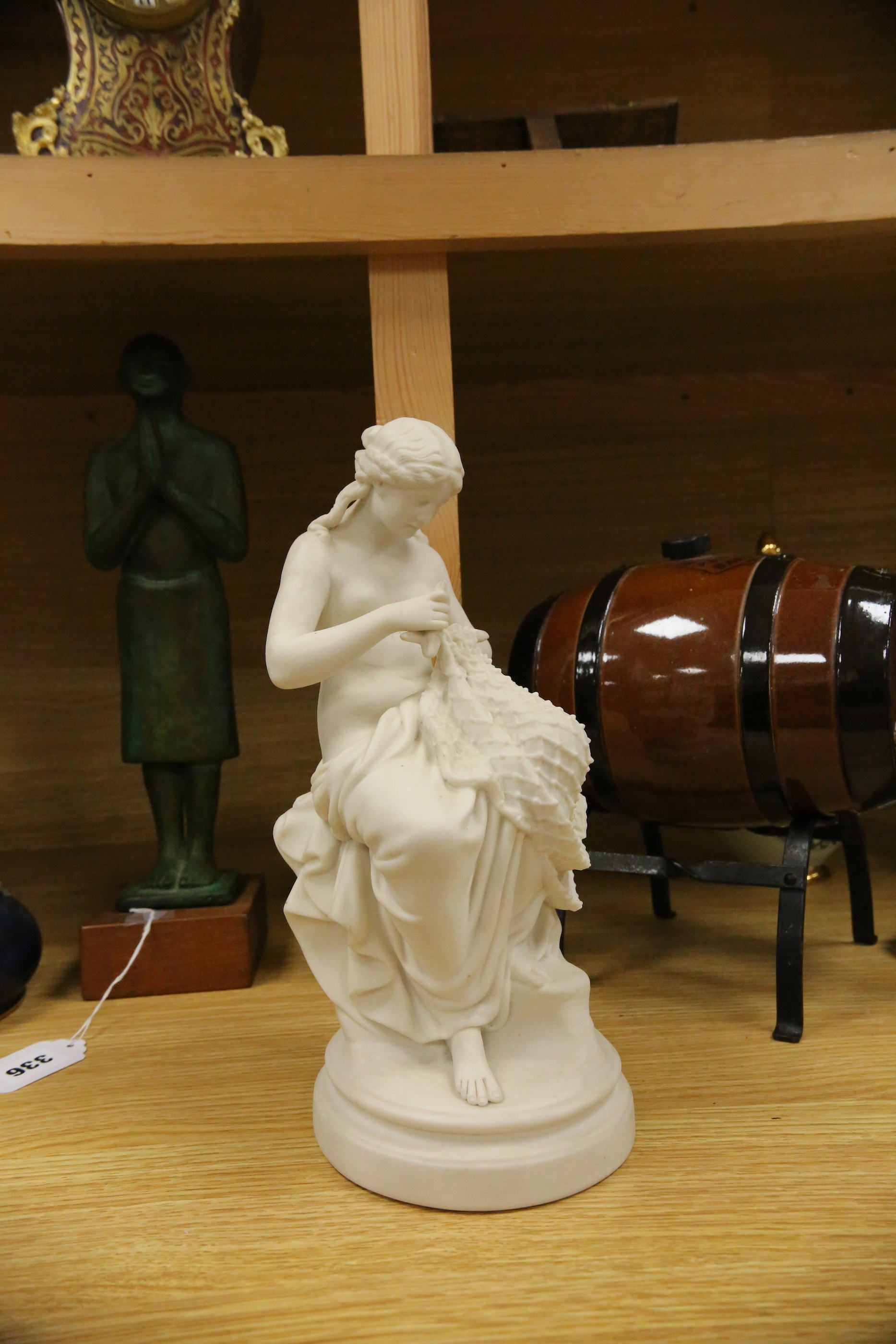 A Parian porcelain figure of a girl mending a fishing net, a Carltonware jar and cover, a “Pedestrian Barrelette” on stand and thirteen various Art Nouveau metal trays, dishes and candlestick including WMF etc, largest t